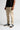Cool sand chino trousers in side view with straight leg shape and stitched seams
