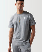 A model wearing a grey Core T-Shirt with the 11 Degrees logo on the chest.