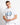 White crew-neck T-shirt with chest crest graphic and small hem brand tag
