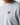 Light gray crewneck sweatshirt close-up of '11°' logo on chest