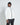 White hooded puffer jacket with black zipper trim and 11° logo on chest