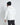 White hooded puffer jacket, back view, black zipper and black hood edge trim