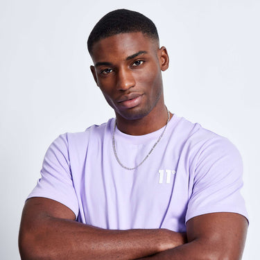 Light lavender crew-neck T-shirt close-up with small white chest logo