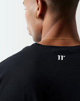Black crew-neck T-shirt neckline detail with '11' logo at upper back.