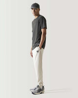Slim-fit joggers in stone beige, tapered leg and cuffed hem