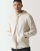 Light beige full-zip hoodie with drawstring hood and small chest logo