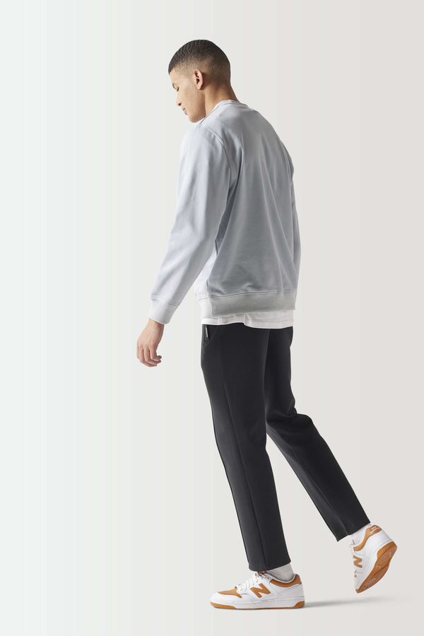 Light gray crewneck sweatshirt, side view with ribbed hem and cuffs