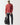 Red crewneck sweatshirt with ribbed cuffs and hem, small black chest logo