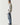 Mid-blue ripped jeans with distressed thigh and knee patches