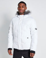 White padded winter jacket with fur-trimmed hood, front zipper, and side pockets