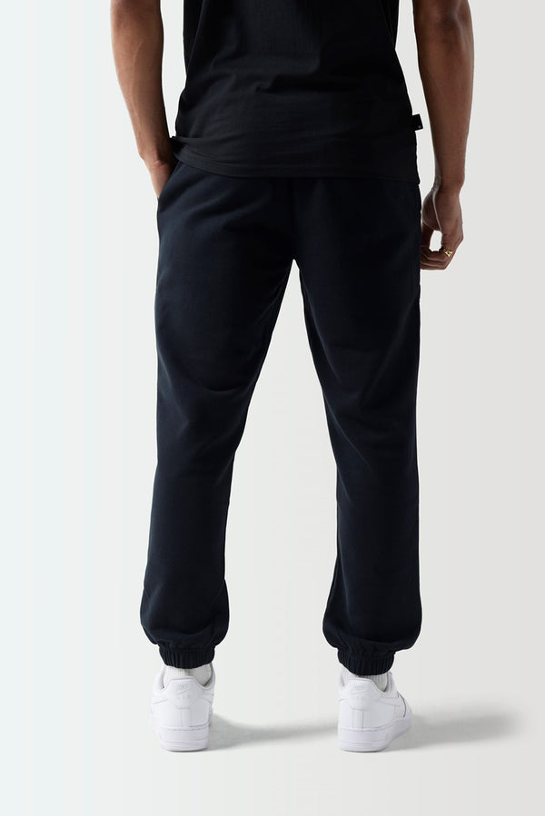 Black regular-fit joggers with tapered legs and elastic ankle cuffs