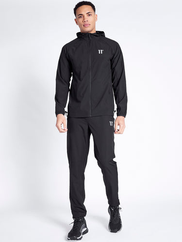 Model Wearing 11 Degrees Black Xenon Tech Pants