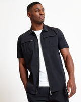 Black utility short-sleeve shirt, front zipper and two chest flap pockets detail