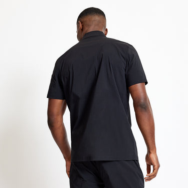 Black utility short-sleeve shirt, back view with clean yoke and short sleeves
