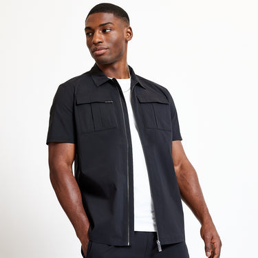 Black short-sleeve utility shirt with open collar, zip front, and flap chest pockets