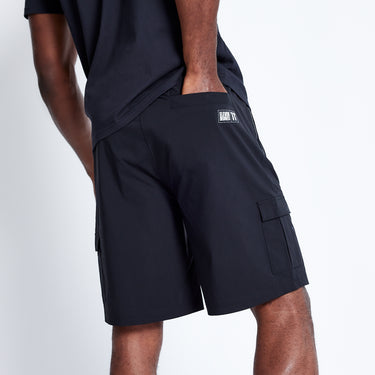 Black utility shorts with side cargo pocket and small logo label at hem