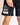 Black sweat shorts with printed side pocket graphic and 11° logo patch