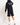 Black sweat shorts, back view, Eleven Degrees logo across waistband