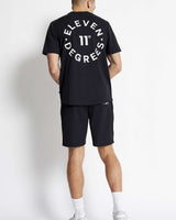 Black mesh shorts with large back print and knee-length hem