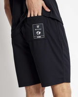 Black mesh shorts with small front logo patch and side seam pockets