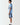 Men's light blue t-shirt showing black vertical side graphic and ELVEN text
