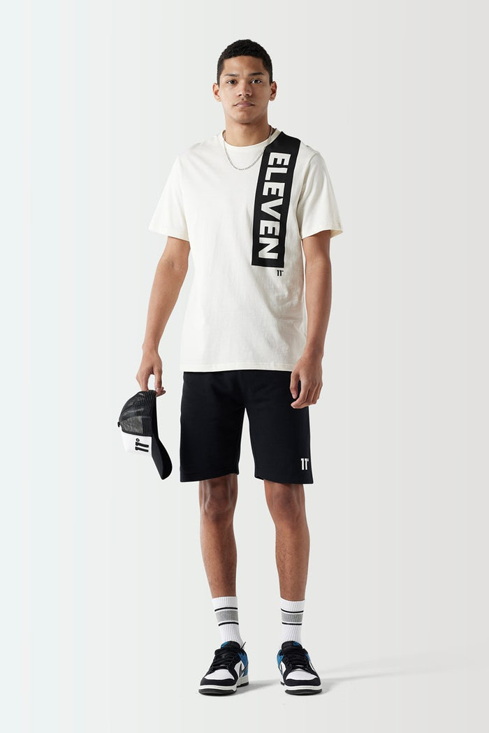 Coconut white T-shirt with vertical black logo block lettering on the front