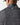 Space-dye long-sleeve quarter-zip close-up: back neck logo and heather texture.
