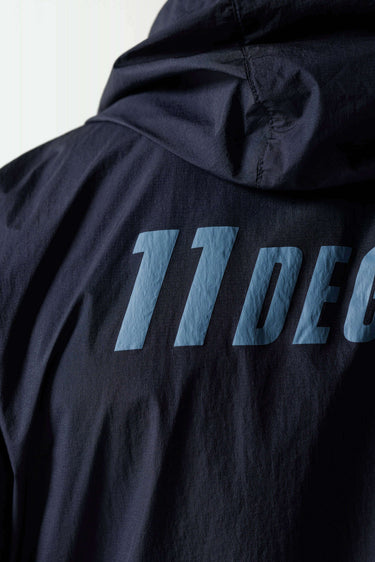 Navy jacket with large turquoise '11°' graphic on back panel