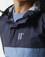 Hooded pullover jacket with 11° chest logo; navy top and light blue bottom
