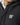 Black puffer jacket with front zipper and chest logo 11°