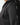 Black hoodie sleeve close-up with vertical graphic tape detail