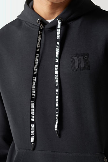Black hoodie with textured drawstrings and small chest logo detail