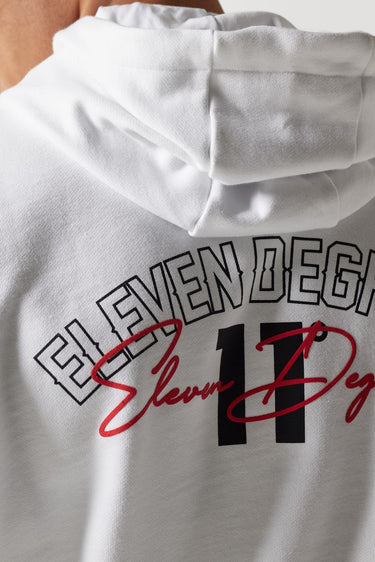 White hoodie close-up of back graphic print with '11°'