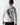 White Crest hoodie back view with large circular crest emblem and hood.