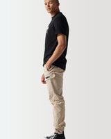 Black crewneck t-shirt with front graphic, short sleeves; side profile