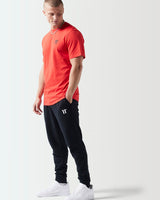 Fiery red t-shirt with small black chest logo and crew neck