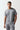 A model wearing a grey Core T-Shirt with the 11 Degrees logo on the chest.