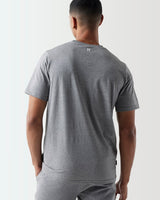Back view of model wearing grey Core T-Shirt 