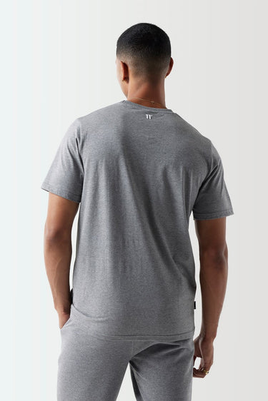 Back view of model wearing grey Core T-Shirt 