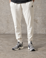 Stone slim-fit joggers with tapered legs, ribbed cuffs, and elastic waistband.