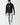 Black pullover hoodie with blue front logo and long sleeve text graphic.
