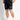 Black mesh shorts with small front logo label and 'Eleven Degrees' text